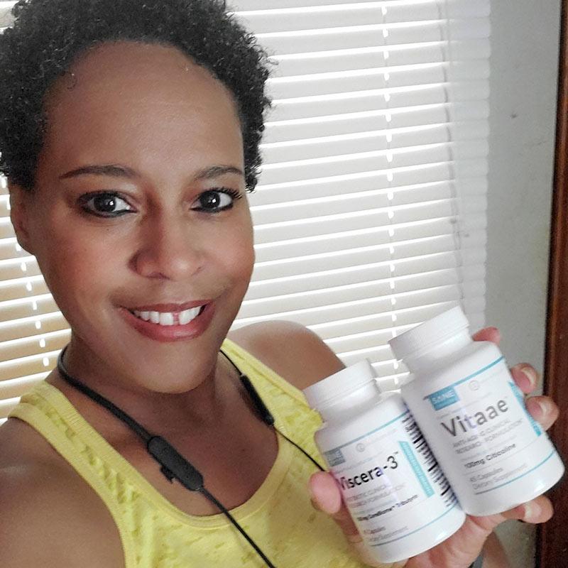 Smiling women holding two bottles of product Viscera-3