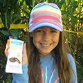 Cute smiling girl with sane product