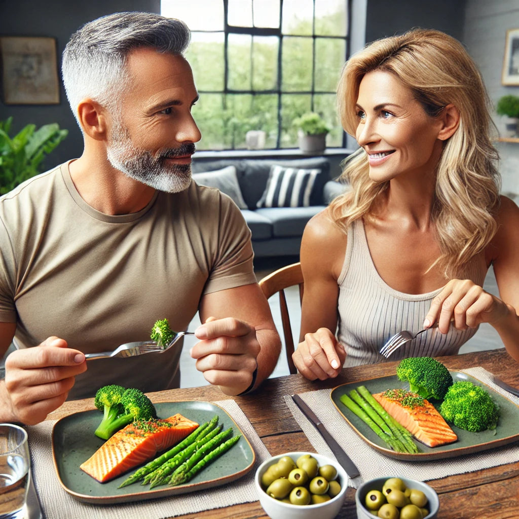 An image of a man and woman eating a healthy dinner to  help regulate fat storage hormones