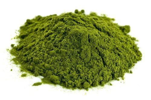 Green Superfood Powder On White Background