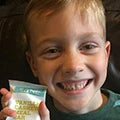 Boy with happy face with sane product
